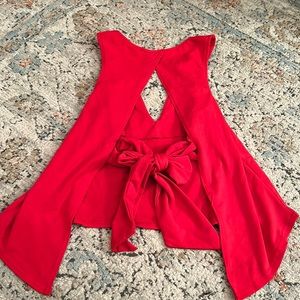 Cheery red open back bow tied too